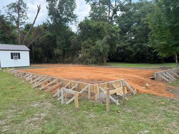 Framing and backfill for the new storage building under construction