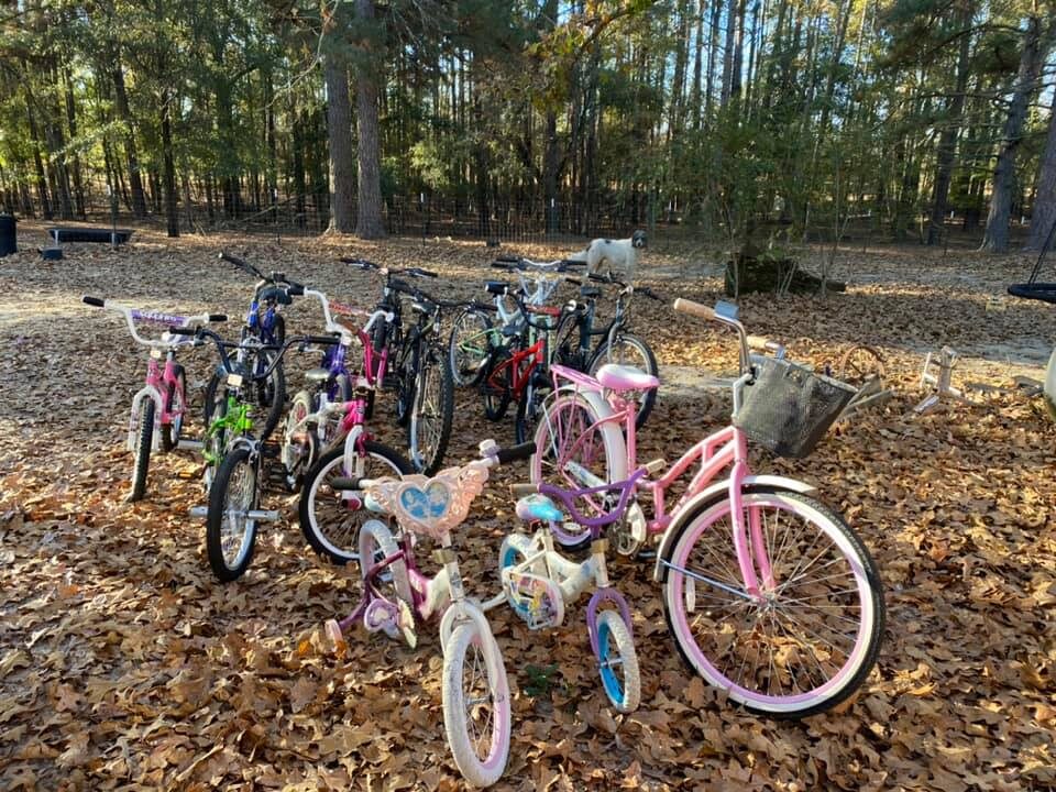 Children receiving bicycles at the annual Christmas bike project
